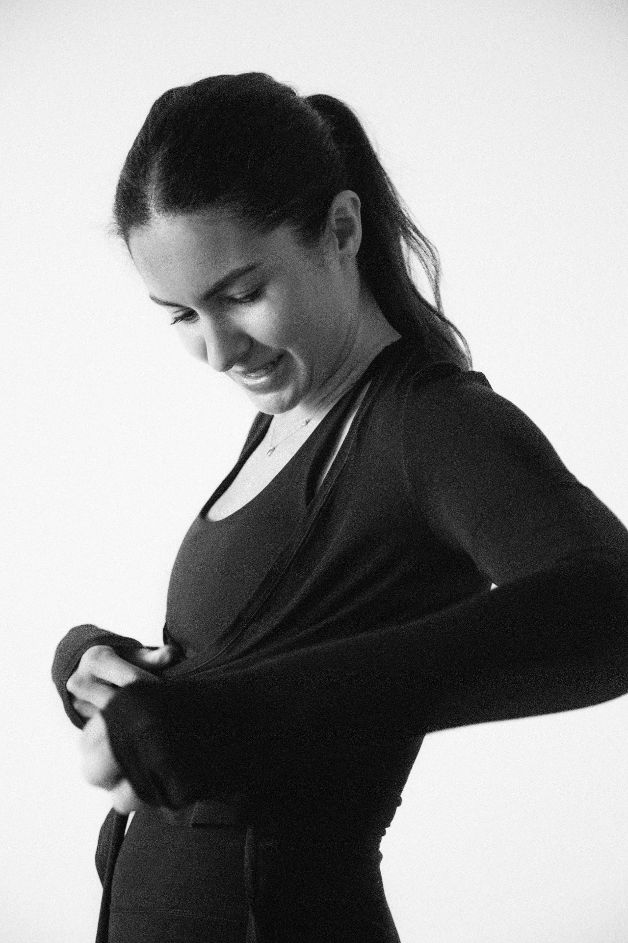 Simona Prada, founder of Sol Pilates, in black activewear